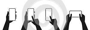 Human hand holding smartphone set icon. Touching smartphone display. Phone holding flat icon sign. Human hands hold vertically