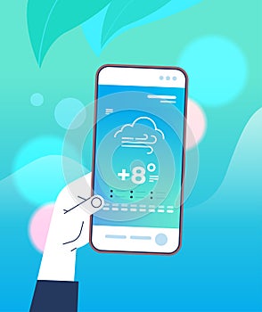 human hand holding smartphone with daily temperature mobile app weather forecasting and meteorology