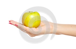 Human hand holding yellow apple