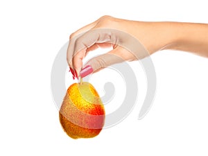 Human hand holding yellow pear