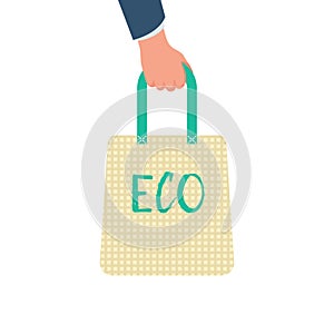 Human hand holds ecological bag.