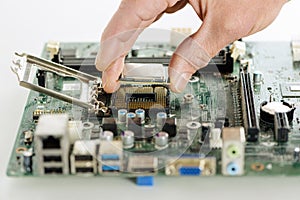 The human hand is installing the processor