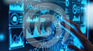 A human hand interacts with a vibrant blue futuristic digital interface displaying complex data visualizations and analytics