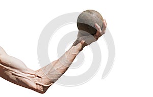 A human hand holds a metal ball
