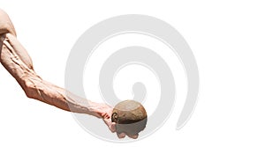 A human hand holds a metal ball photo