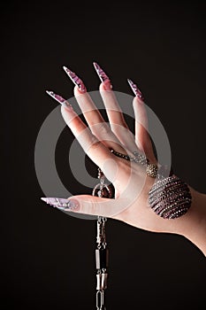 Human hand with long fingernail photo