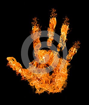 Human hand in orange flame on black