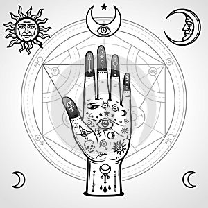 Human hand painted with magic symbols. Alchemical circle of transformations. photo
