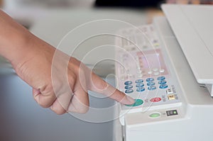 Human hand press on start button