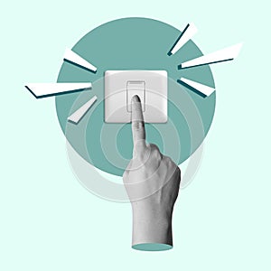 A human hand presses a switch button