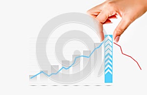 Human hand pulling graph bar suggesting increase of sales or business photo