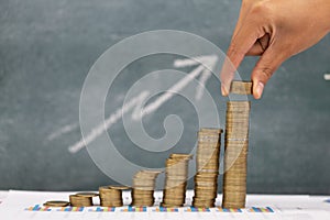 Human hand putting coins money stack step growing growth saving money, deposit Close up of person hand stacking golden coins,