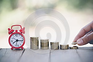 Human hand putting coins money stack step growing growth saving money, deposit Close up of person hand stacking golden coins,