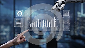 Human Hand Interacting with Robotic Hand Displaying Data Visualization in Modern Office Environment with Digital Graphs