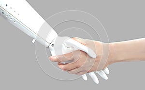 Human hand and Robot hand. Handshake. Cyber communication concept isolated on grey background. Future technology.