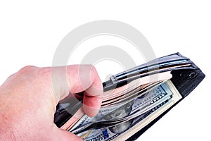 Human hand sorts 100 USD bills in a black purse. Isolated on white background.