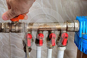 Human hand turn off shut-off valve home water supply.