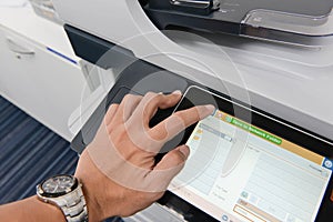 Human hand is use the printer