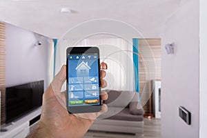 Human Hand Using Smart Home System On Smartphone