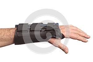 Human hand with a wrist brace, orthopedic equipment isolated on white background with clipping path and copy space for your text