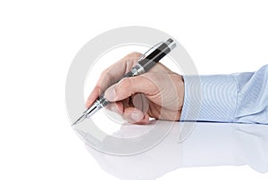 Human hand writing with silver pen