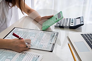 Human hands with 1040 tax form closeup