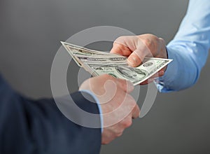 Human hands exchanging money