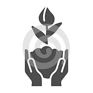 Human hands hold closed tulip bud in soil solid icon, spring concept, Flower bud sign on white background, Flower grows