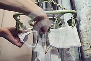 Human hands in  holding laundered protective mask