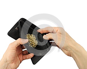 Human hands holds open black leather wallet with gold yellow jewelry chain, investment in treasure, closeup, isolated