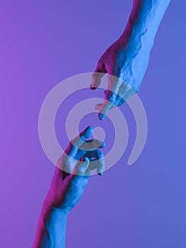 Human hands in neon light Stretched towards each other as a symbol of connection between people. 3d rendering.