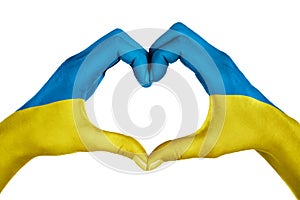 Human hands, painted with ukraine flag,  forming heart shape