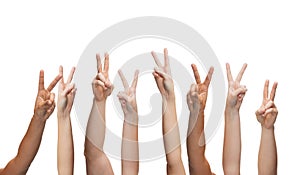 Human hands showing v-sign