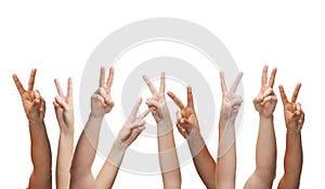 Human hands showing v-sign
