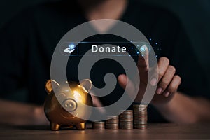 Human hands touching the button giving donations money to charity help offer volunteer concepts online via the internet