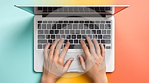 Human hands typing laptop keyboard, pastel background, top view