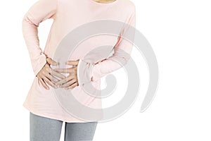 A human having painful stomachache on white background.Chronic gastritis. Abdomen bloating concept.Close-up Of Woman using hands