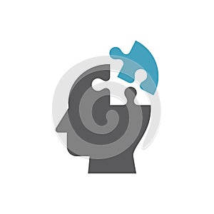 Human head with brain puzzle piece icon