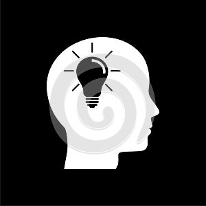 Human head with light bulb iconon dark background