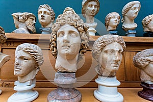 Human heads, marble copies of old Roman emperors and gods. Ancient history concept