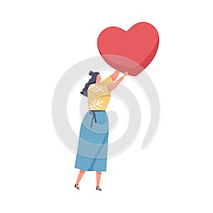 Human holding big red heart in hand as symbol of love. Concept of charity, hope, solidarity and compassion. Woman