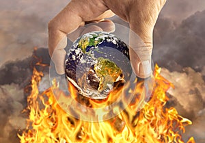 Human holding earth on fire