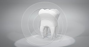Human molar tooth isolated on light background