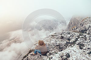 Human in mountains in fog