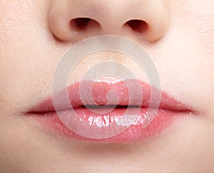 Closeup macro portrait of female part of face. Human woman lips with day beauty makeup