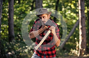 human and nature. man hiking in wood. poacher in forest. deforestation. ranger or poach. man forester use axe. search photo
