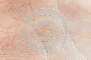 Human palm skin texture background. Macro photo, close up. Palmistry concept