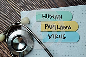 Human Papiloma Virus HPV text on sticky notes with office desk concept