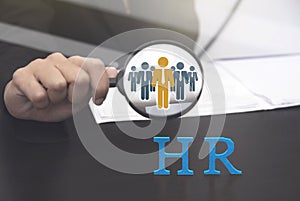 Human resource holding magnifying glass searching. concept HR