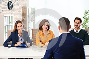 Human resources commission conducting job interview with applicant photo